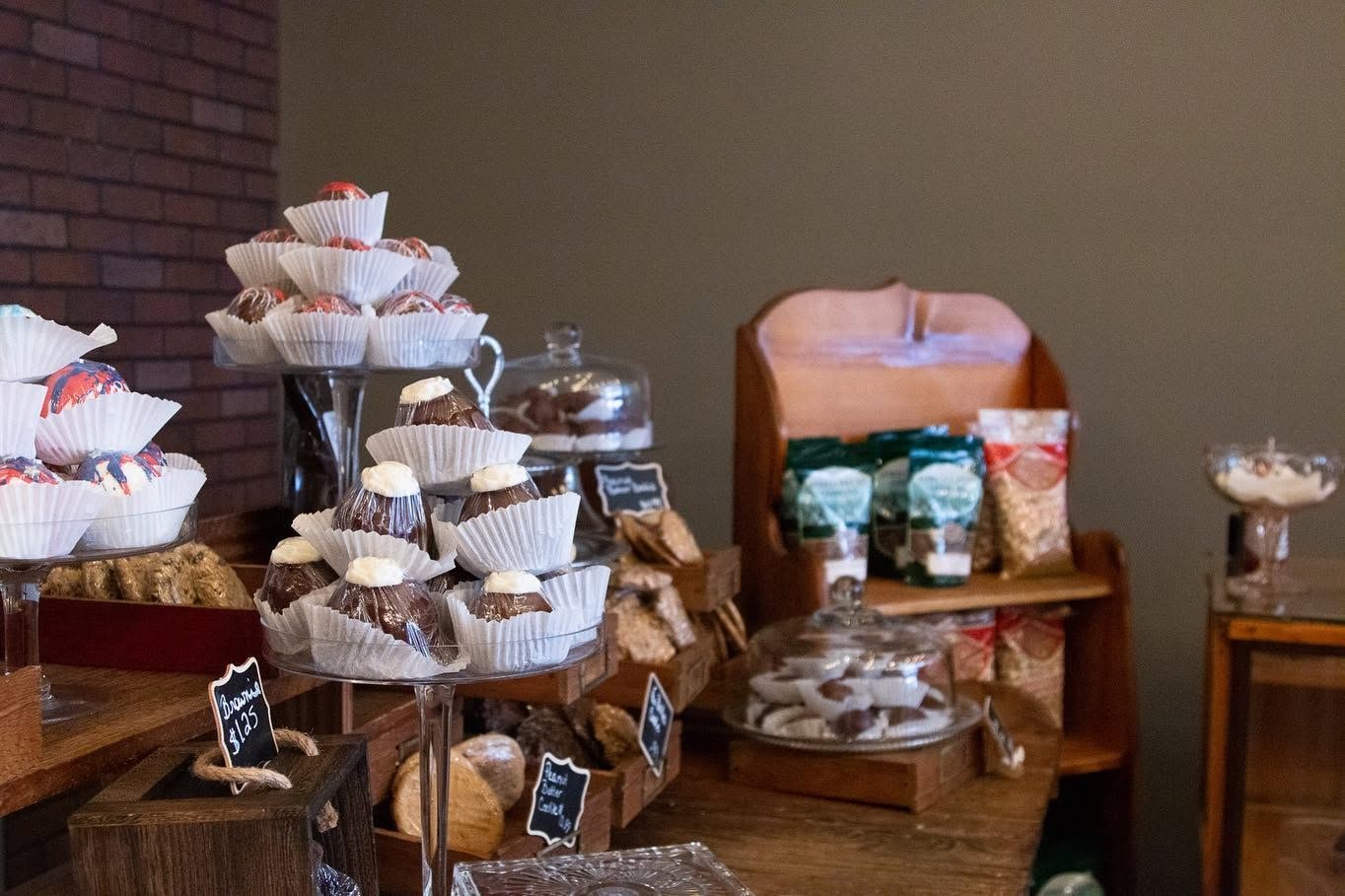 Bakery display with brownies, cookies, packaged sweets, and dessert cups