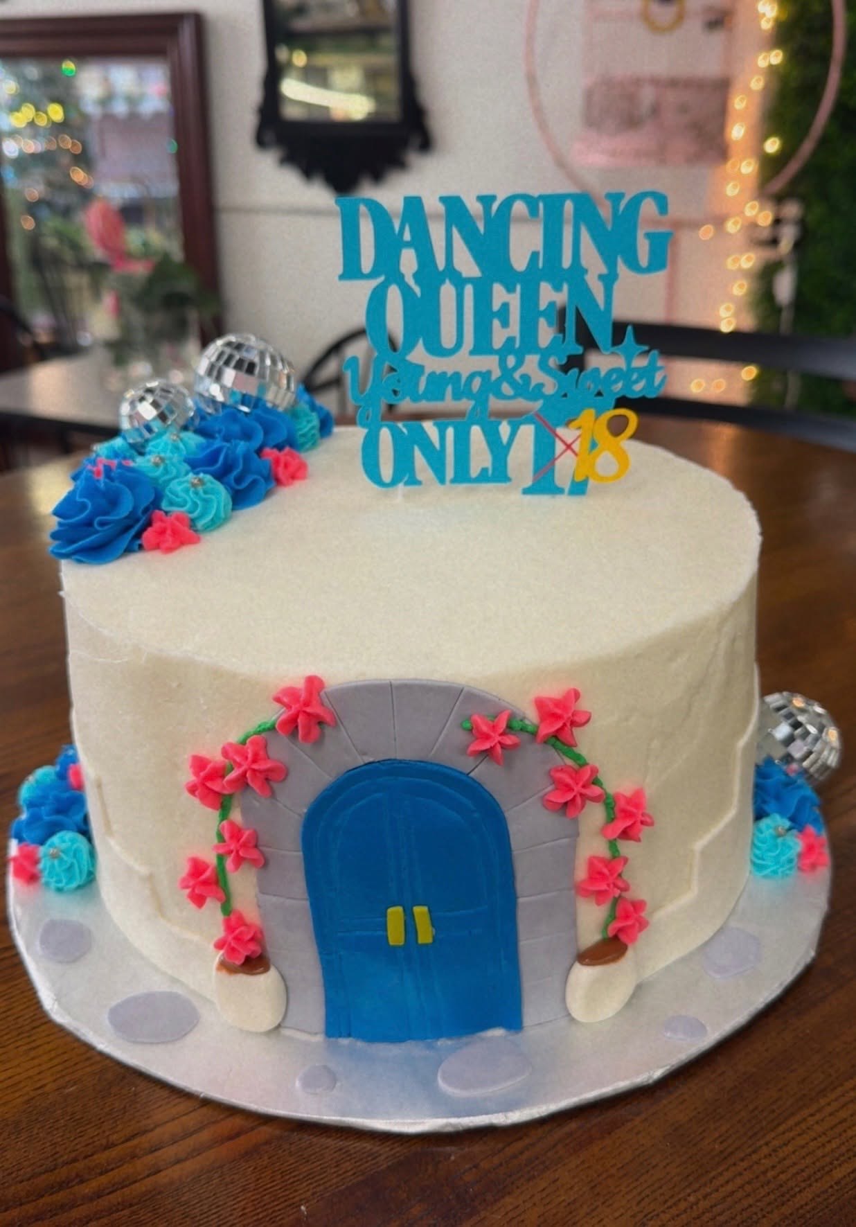 Dancing Queen themed birthday cake with blue and pink details