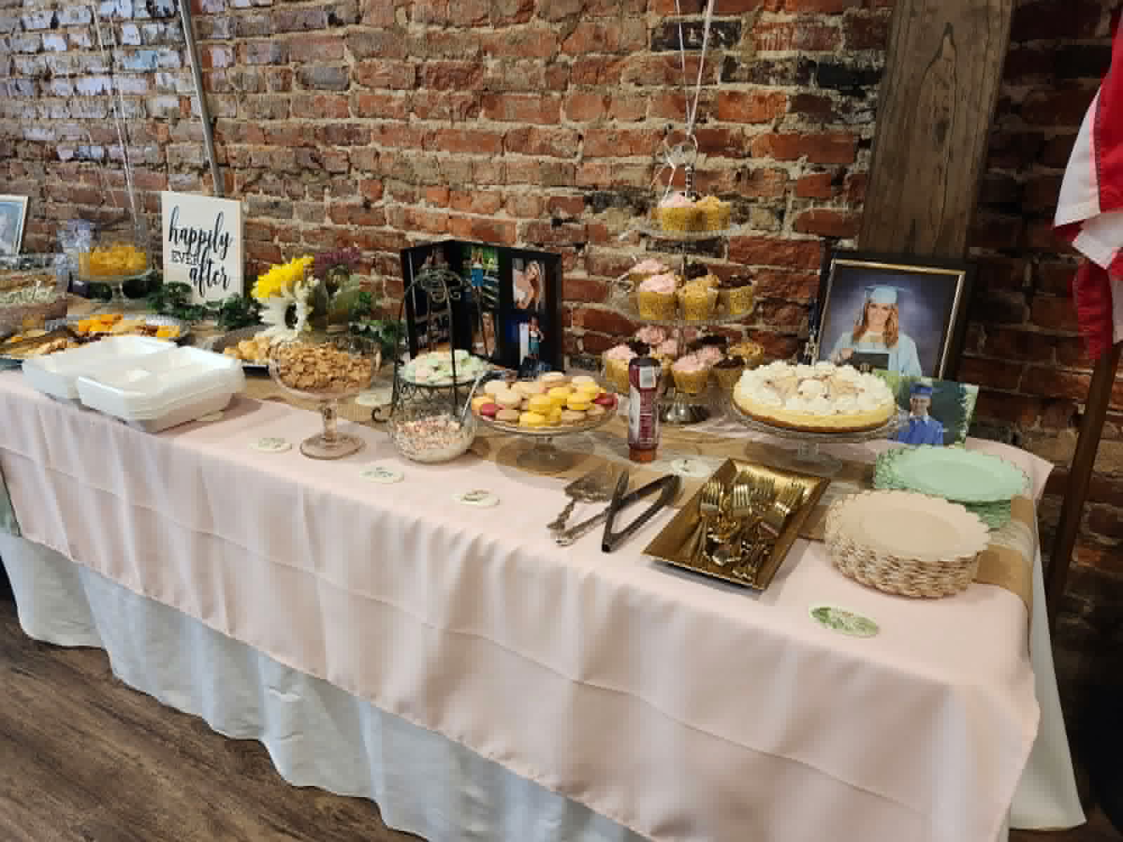 Simply Elegant dessert table with cupcakes, cookies, macarons, and graduation celebration details