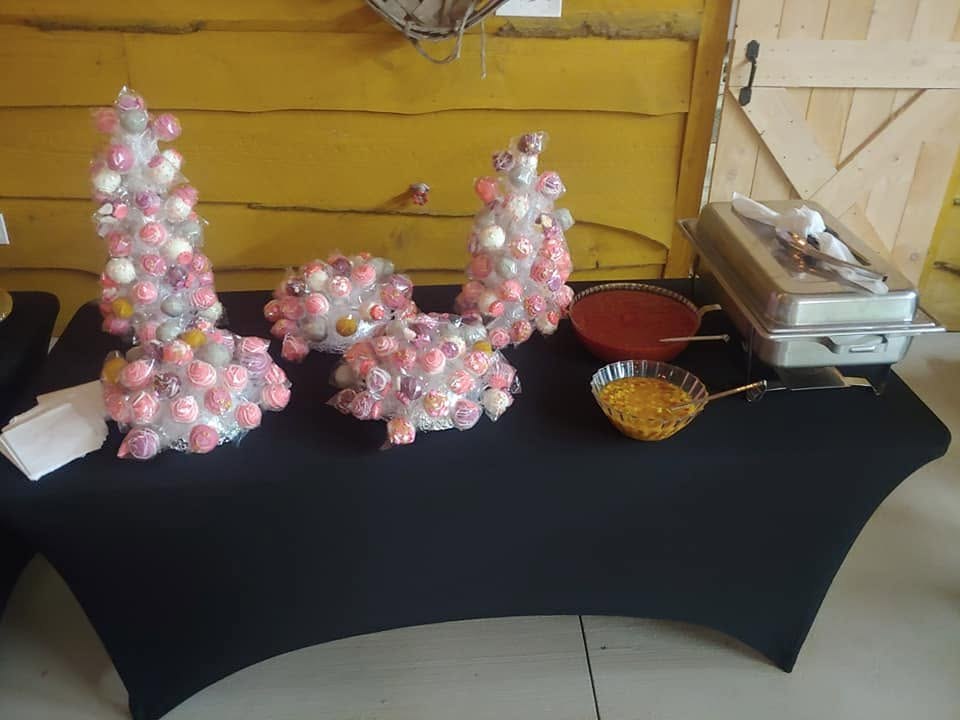 Pink and white wrapped sweets arranged into decorative display towers