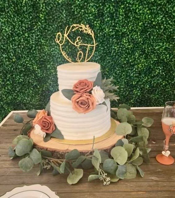 Wedding cake with sage greenery and dusty rose flowers